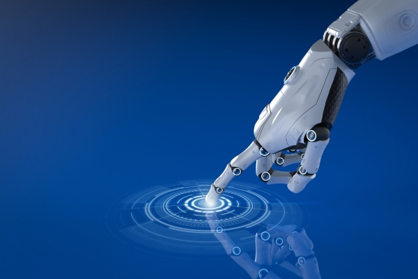 Close-up of an artificial intelligence robot arm touching a glowing circular digital interface on a blue background.