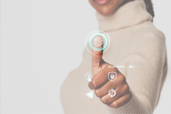 Finger touching a glowing digital fingerprint icon, representing AI security authentication.
