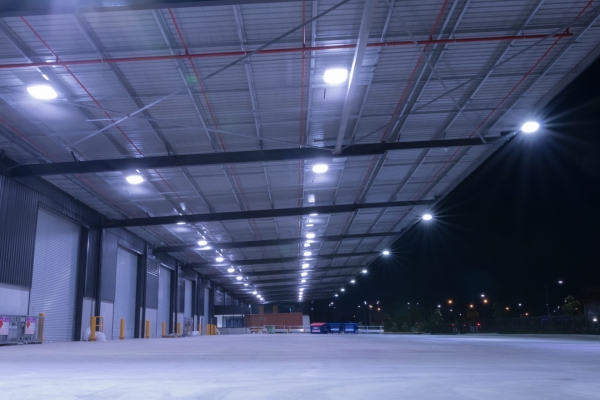 Empty warehouse at night with bright lights